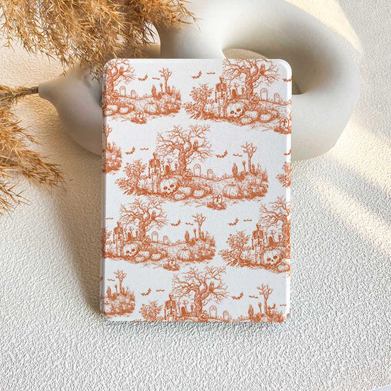 A Kindle case with a vintage Halloween design featuring orange color and a pattern of ghosts, trees, and skulls.