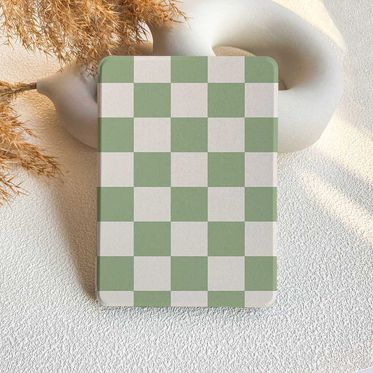 A Kindle case with a green and white checkerboard pattern displayed on a neutral background.