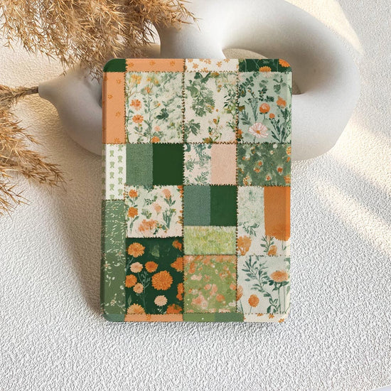 Patchwork notebook with floral patterns on a textured surface
