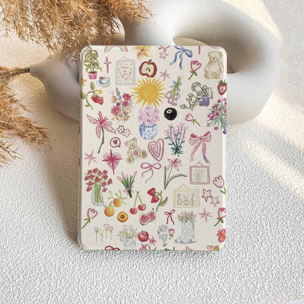 Small notebook with a colorful doodle design on a textured surface.