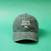 Green cap with 'BOOK GIRLIE' text on a green background