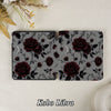 Floral patterned Kobo Libra cover on a textured surface with flowers in the background
