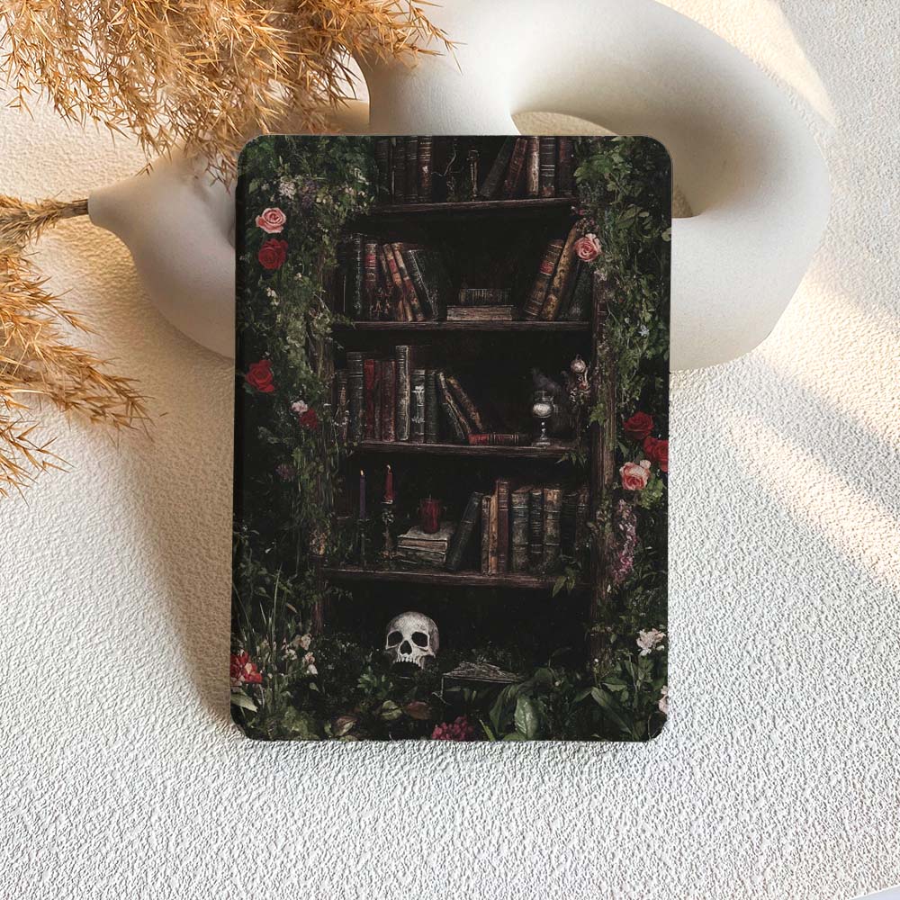 Decorative metal tin with a bookshelf design featuring books, flowers, and a skull on a textured white surface.