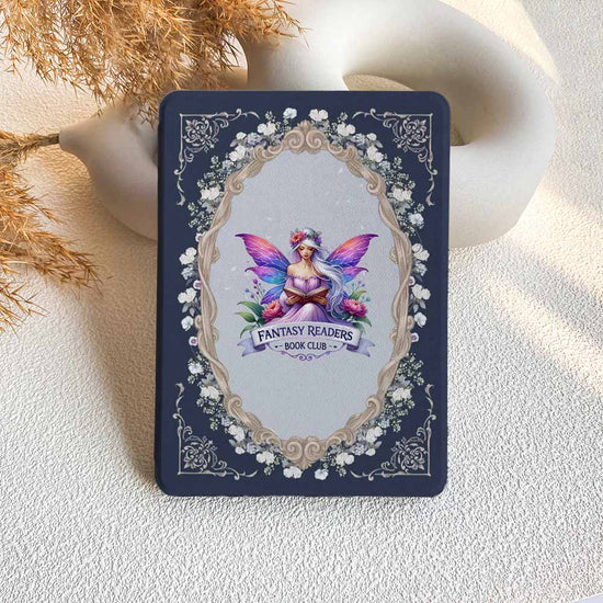 Card with a fairy design and 'Fantasy Readers Book Club' text on a textured surface.