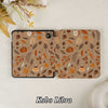 Kobo Libra tablet with a fall-themed case on a light background