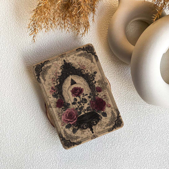Decorative book with floral design on a textured surface