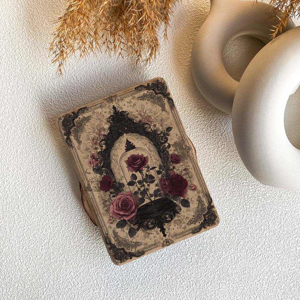 Decorative book with floral design on a textured surface