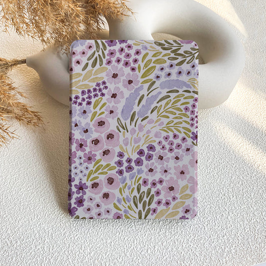 Floral patterned notebook on a textured surface with decorative elements