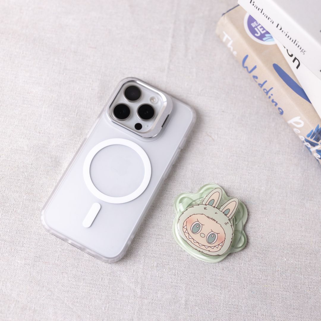 Phone case with a cute animal design on a light gray surface