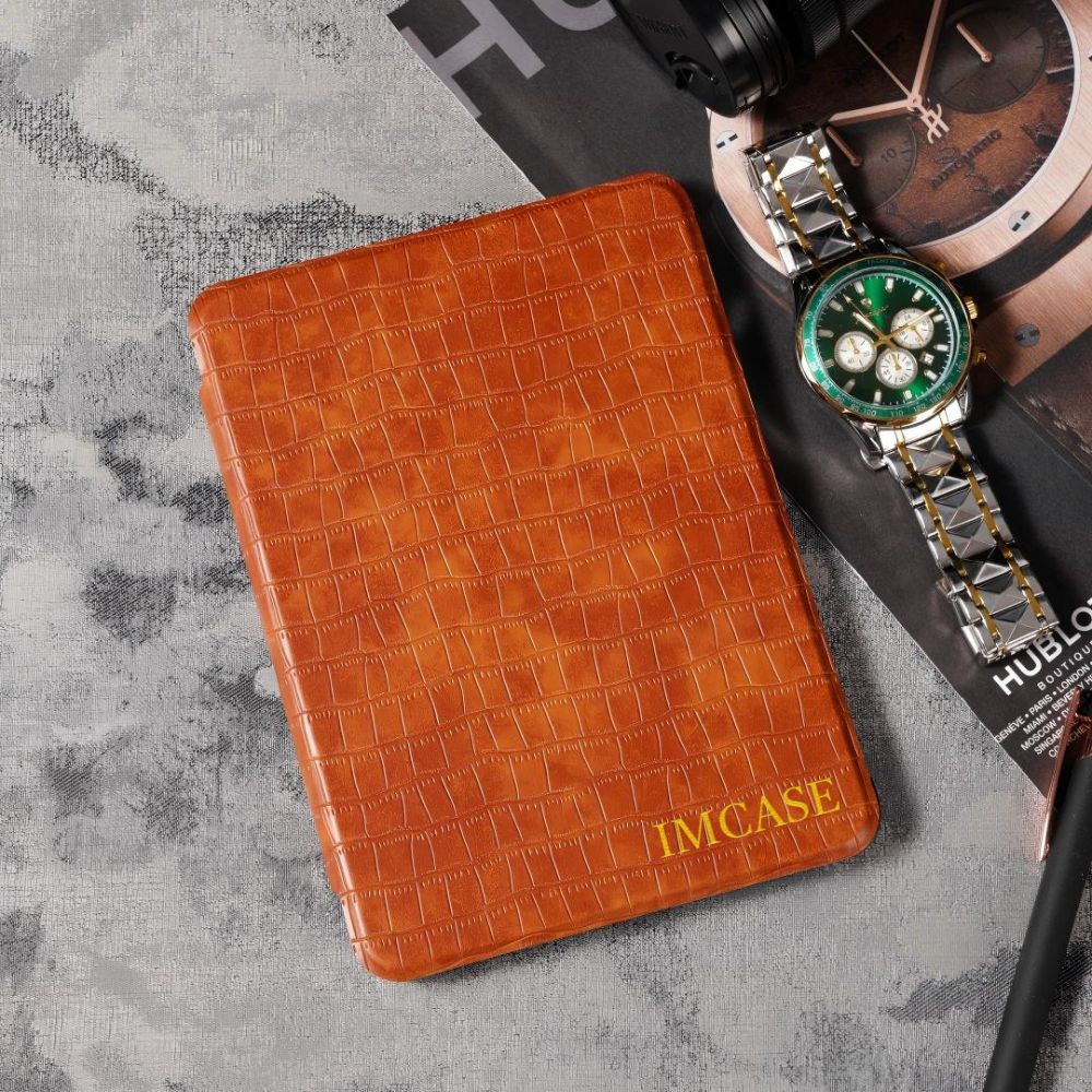 Brown crocodile-patterned case with 'IMCASE' branding on a textured surface.