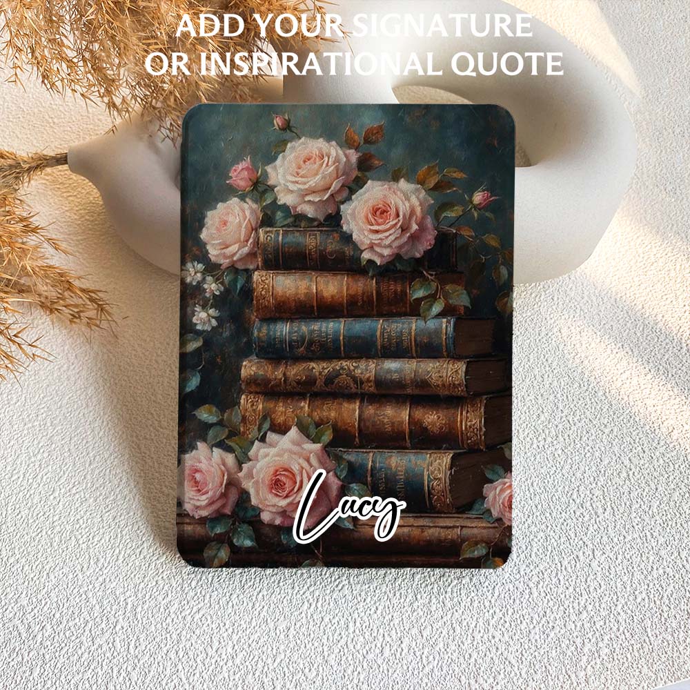 kindle case with vintage books and roses on a textured surface